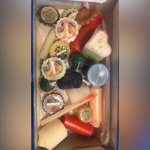 See description. Shoe box of assorted candles.